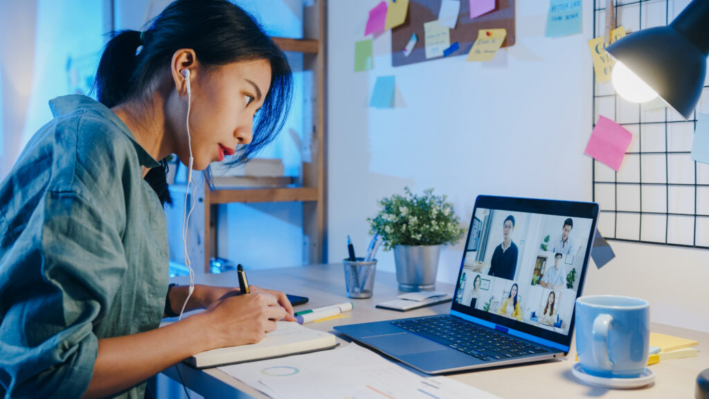 Asian student using laptop for an online class